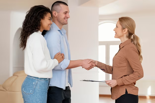 Couple Meeting Realtor and Shaking Hands